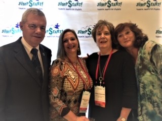 AFDICA President Selby with three of the teachers we sponsored.